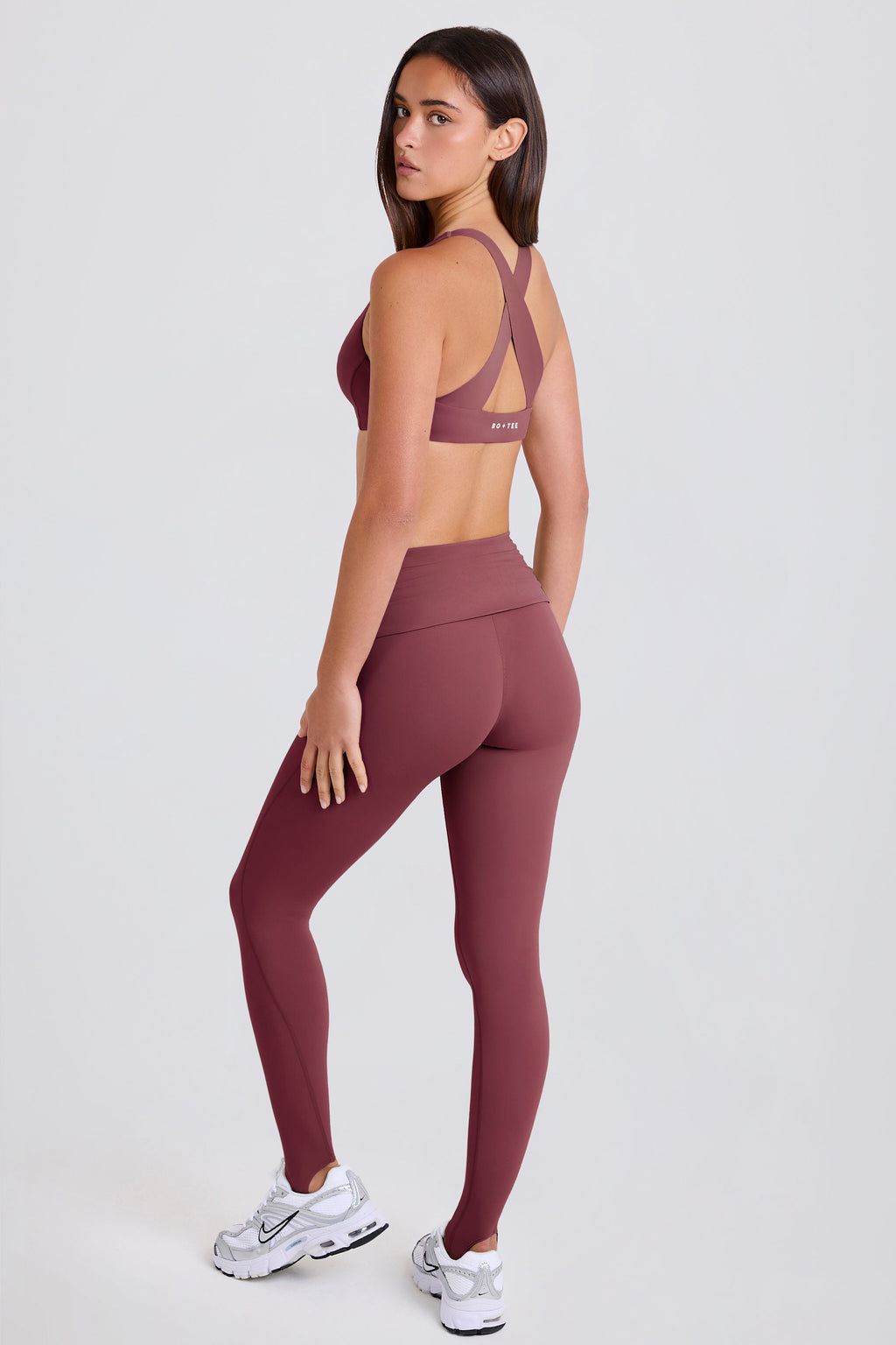 Four-Way Stretch Foldover Mid-Rise Stirrup Leggings in Acai