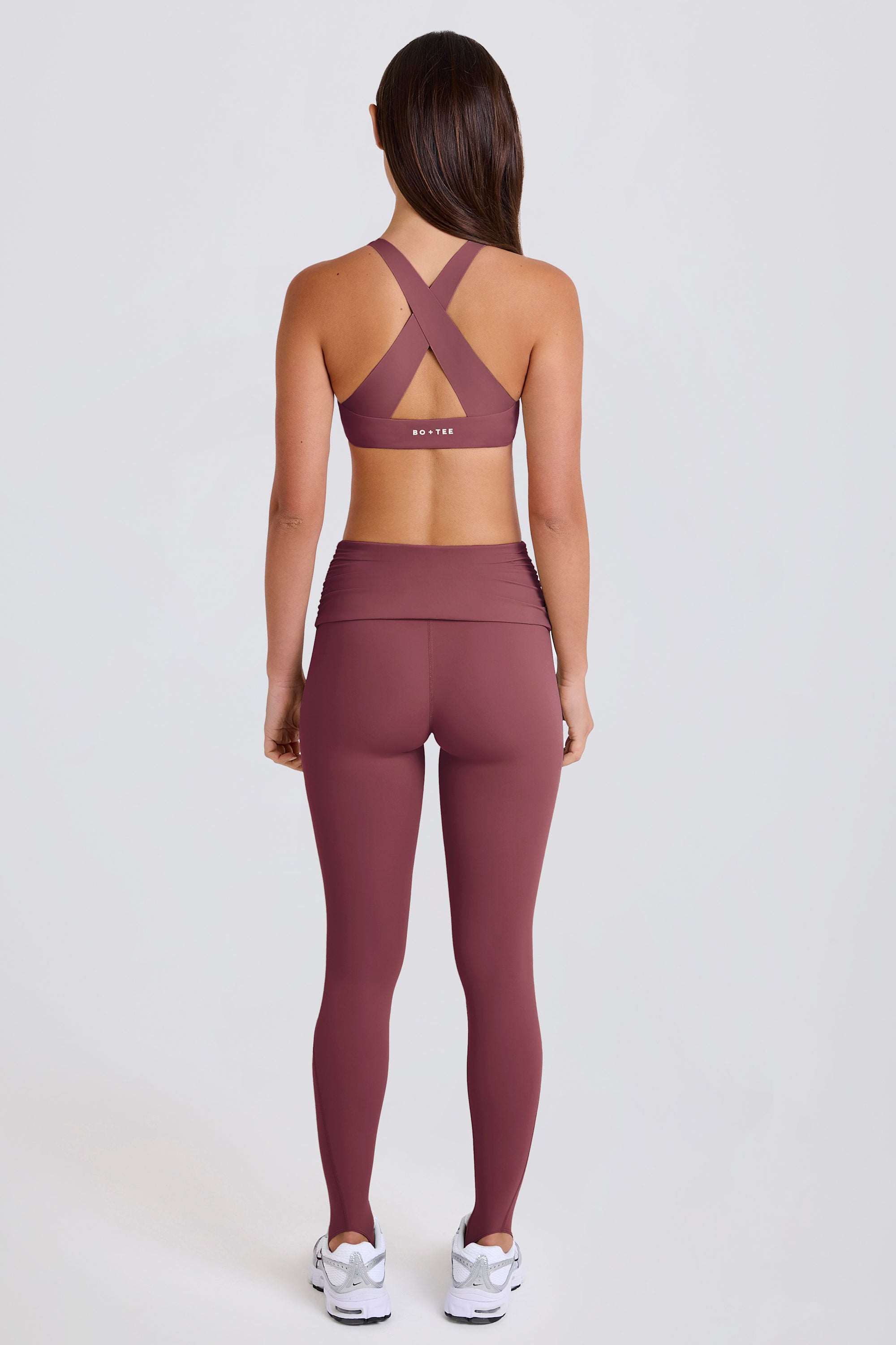 Four-Way Stretch Foldover Mid-Rise Stirrup Leggings in Acai