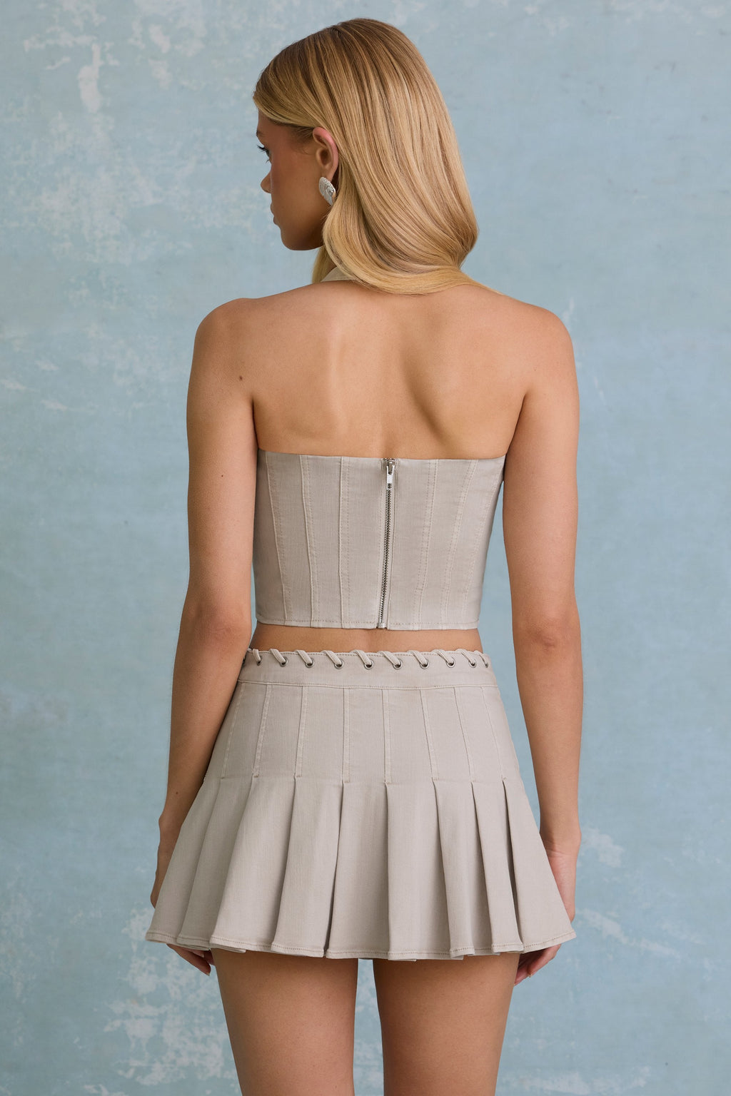 Low-Rise Pleated Mini Skirt in Ecru