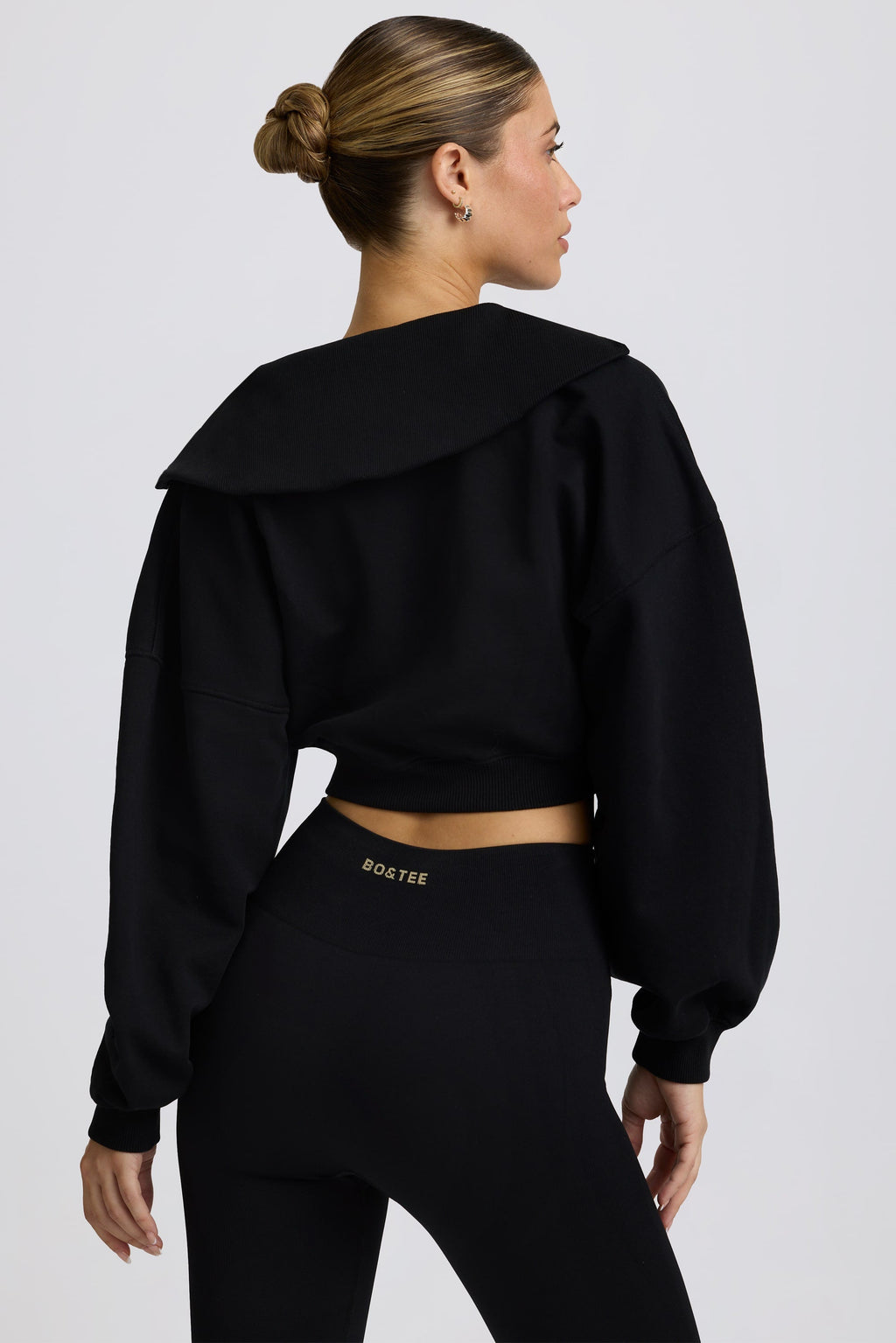 Fleece Lined Quarter-Zip Cropped Sweatshirt in Black