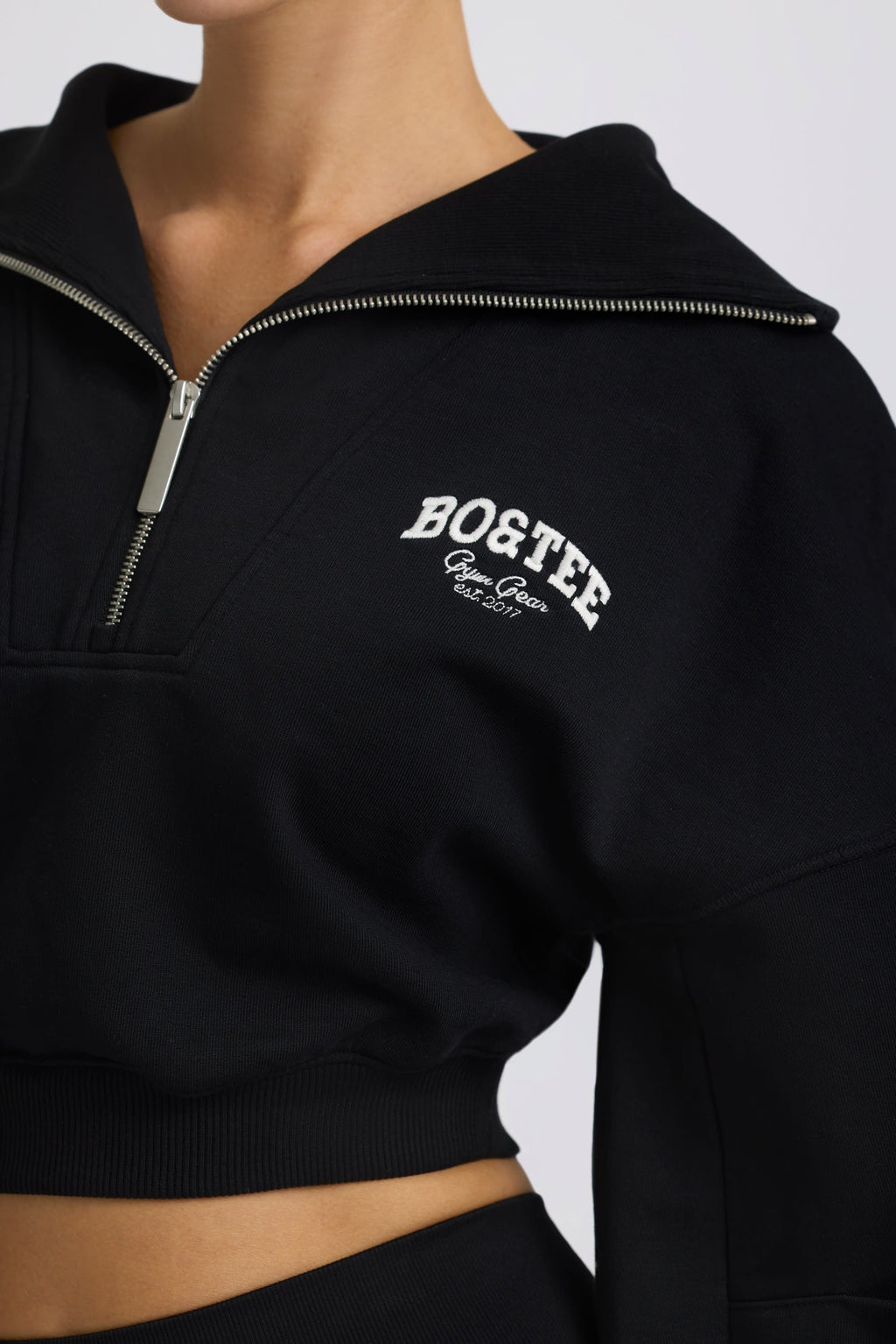 Fleece Lined Quarter-Zip Cropped Sweatshirt in Black