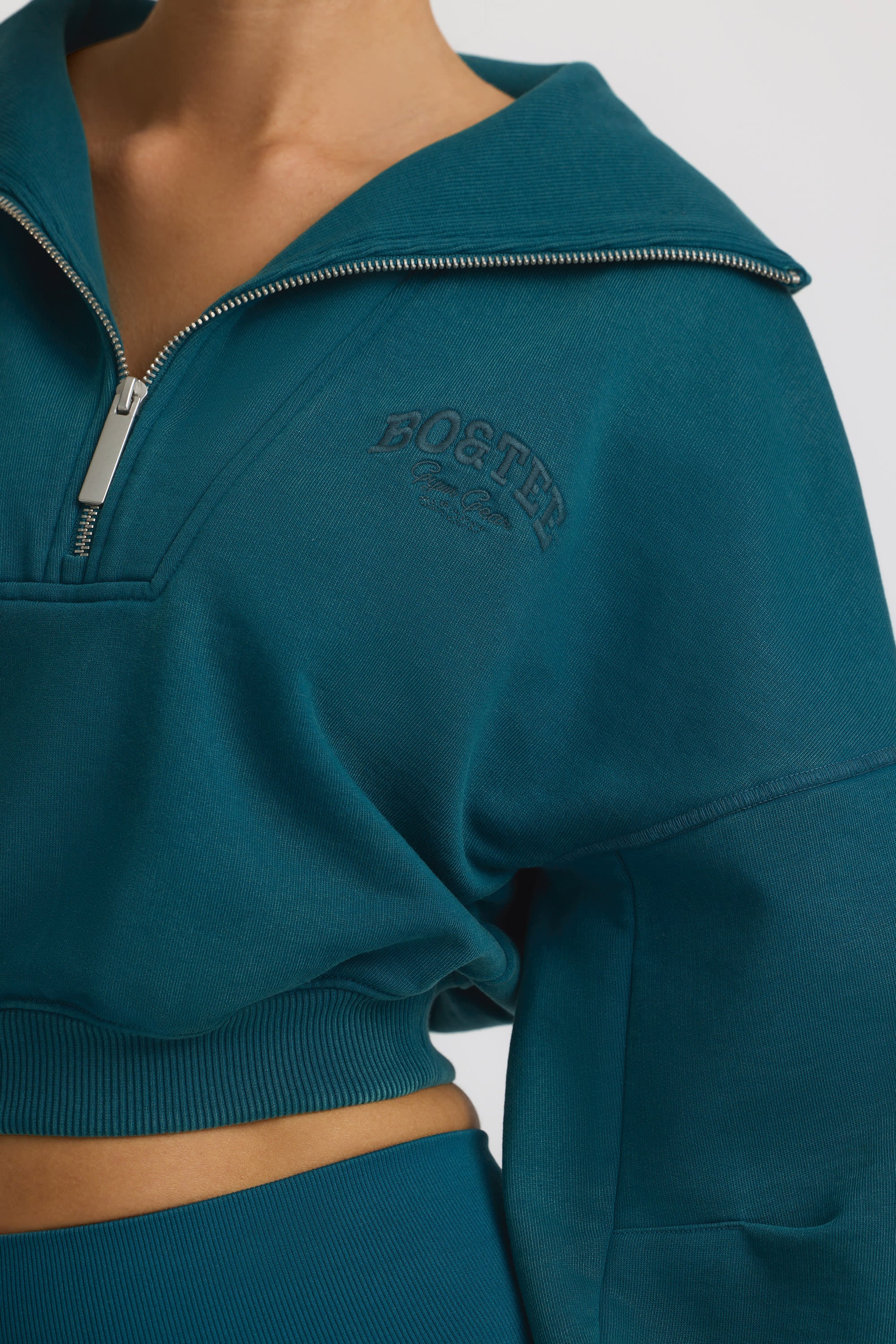 Fleece Lined Quarter-Zip Cropped Sweatshirt in Teal