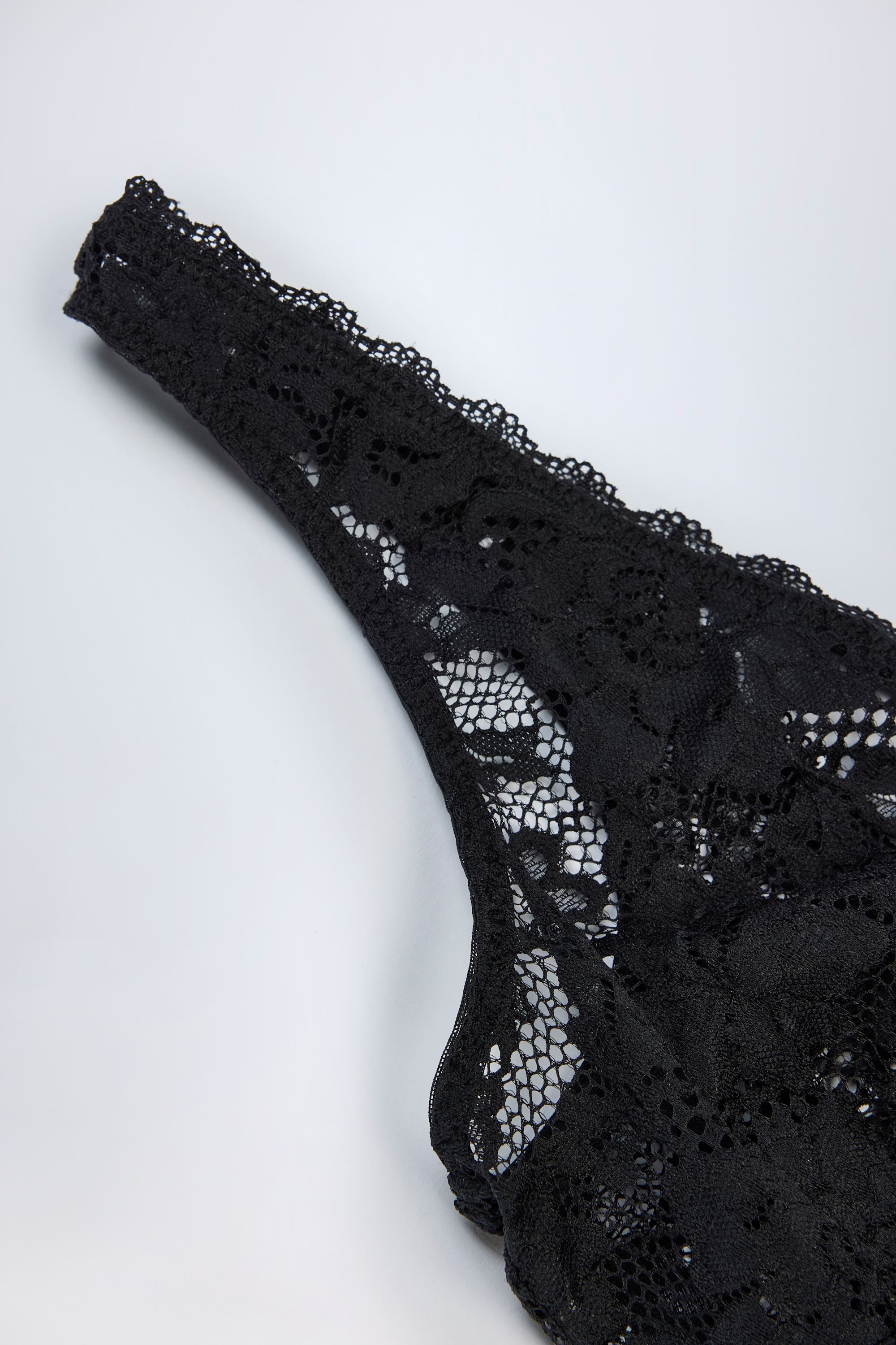 Plunge-Neck Lace Bodysuit in Black